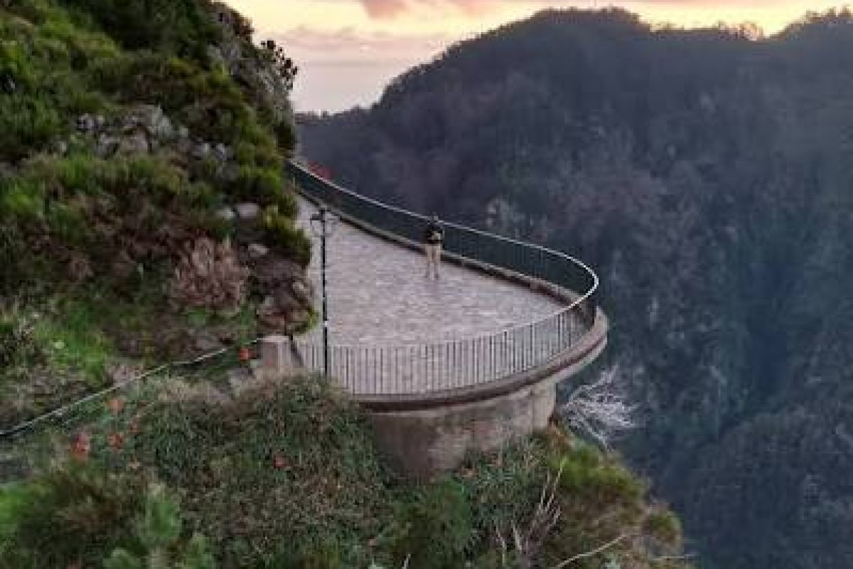 Eira do Serrado viewpoint platform on a mountain ridge at sunset, Madeira